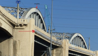LA 6th St Bridge notice bagging to catch falling particles_edited-1